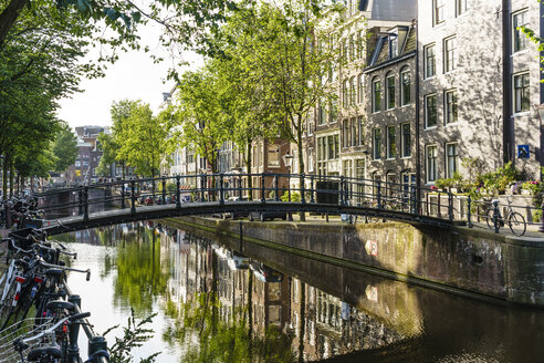 old-gabled-buildings-reflecting-in-a-canal-amsterdam-north-holland-the-netherlands-europe-RHPLF12309